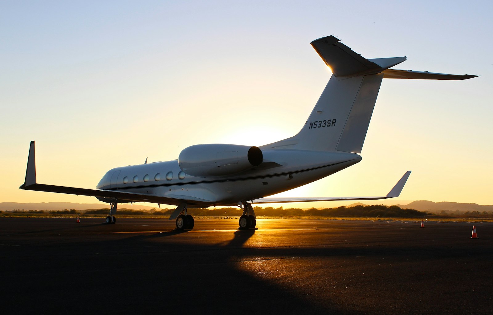 Private jet on the tarmac at golden hour